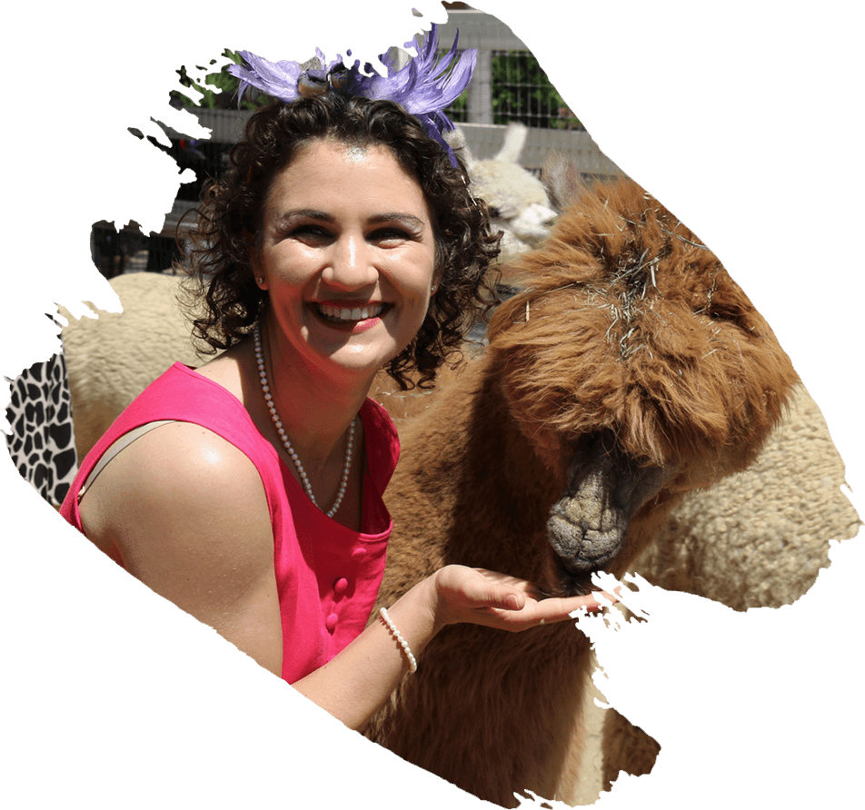 Beautiful smiling young lady with alpaca